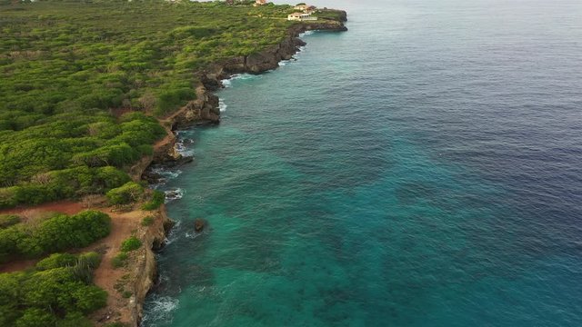 Aerial view of coast of Curaçao in the Caribbean Sea with turquoise water, cliff, beach and beautiful coral reef around Watamula