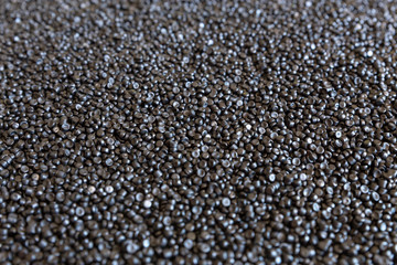 Close-up of plastic polymer granules. hand hold Polymer pellets. polymer plastic. compound polymer.