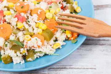 Fresh salad with couscous and vegetables. Best nutritious food for dieting and slimming. Source...