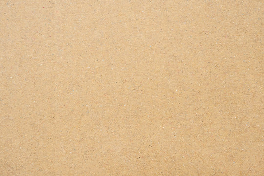 Paper texture in brown. Old paper background with detail of texture.