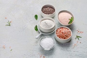 Different salt  types on grey background.