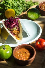 fried chicken tacos served with sauce