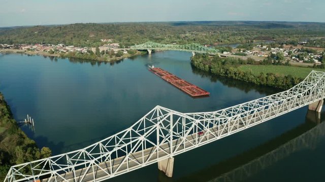 River Barge Slowly Moves Thru the Ohio River Between Henderson and Point Pleasant WV