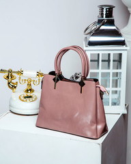 pink leather bag with short handles