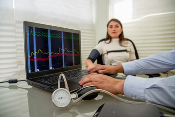 woman in polygraph test with measuring devices to know the truth, scales, hoses and measuring tubes...
