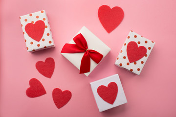 Valentines gift boxes, red bow and felt hearts