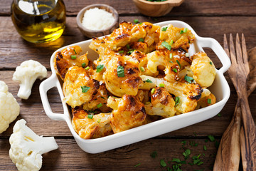 Vegetarian food. Baked cauliflower with herbs and parmesan cheese.