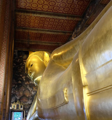 The world's largest sculpture of a reclining Buddha in a temple in Bangkok. © Oleksii