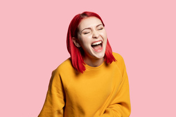 Funny girl teenage laughing on humor joke portrait. Happy caucasian young woman in trendy outfit...