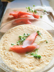 Close up homemade steamed egg with Crab sticks and vegetable on top.