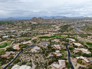 Aerial view above golf course and upscale luxury homes in Scottsdale, Arizona