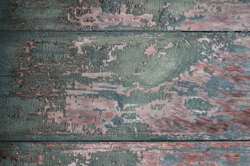 Background of shabby paint on the wooden door.