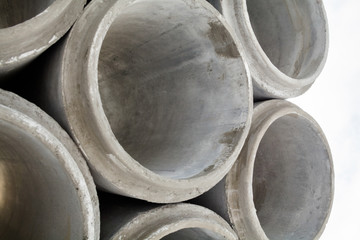 Stack of new concrete pipes.
