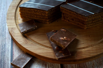 Chocolate cake on a wooden background. Chocolate cake on a wooden background. Homemade cakes, dessert