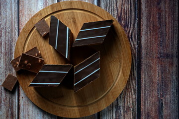 Chocolate cake on a wooden background. Chocolate cake on a wooden background. Homemade cakes, dessert