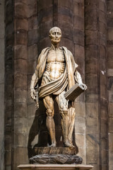 Milan, Italy - March 8, 2019: Statue of St. Bartholomew Flayed was one of 12 Apostles and an early Christian martyr that was skinned in the Duomo di Milano, Milan cathedral, Sculpture