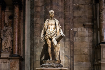 Milan, Italy - March 8, 2019: Statue of St. Bartholomew Flayed was one of 12 Apostles and an early Christian martyr that was skinned in the Duomo di Milano, Milan cathedral, Sculpture