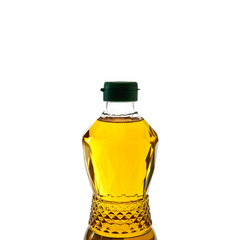 Vegetable oil in plastic bottle on white