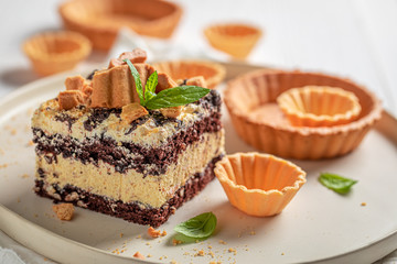 Homemade chocolate cake with wanilla cream and cookies