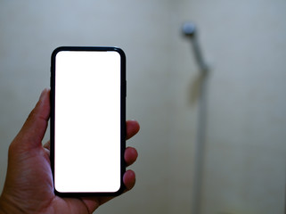 Smart phone with white screen background in bathroom, bath or toiletry. Closeup of hands using mobile phone with blank copy space screen, empty white screen for advertising text in bath room