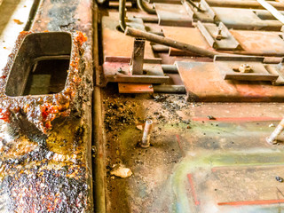 a professional polisher is polishing an old and rusty an electric cooking fry pan