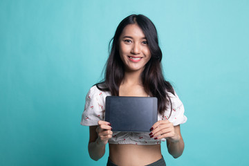 Young Asian woman with a computer tablet