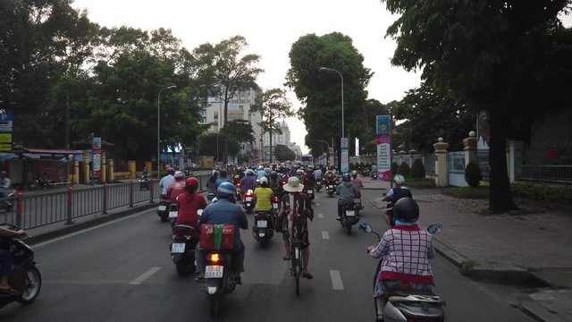 Ho Chi Minh city, Vietnam 11 2019: Royalty high-quality free best stock footage of slow moving traffic with lots of motorbike, bus, motor, car... transport on road in Ho Chi Minh city in the morning