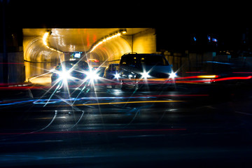 Night traffic in front of city tunnel