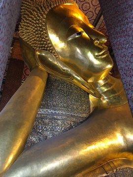 Golden statue of Buddha in Wat Pho, Bangkok Thailand