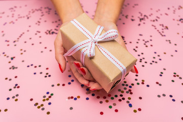 gift box with ribbon and bow on red background