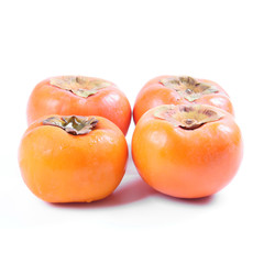 Ripe persimmon fruit isolated on white background