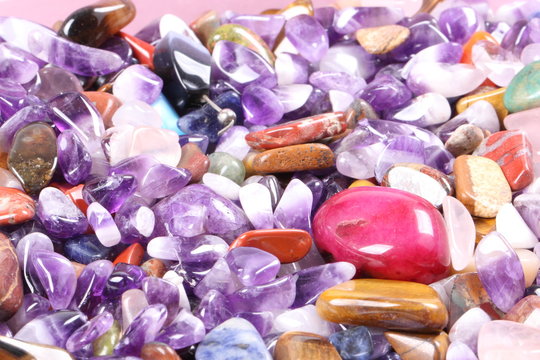 pile of semi precious jewelry stones closeup