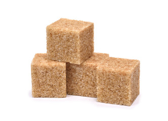 pieces of cane sugar isolate on white.Entire image in sharpness.