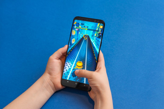 Sarajevo, Bosnia and Herzegovina - November 30, 2019: Boy playing Despicable Me: Minion Rush action mobile game on Samsung Galaxy S9 plus phone close-up