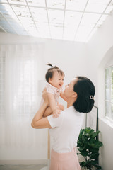 asian baby and mom with smile