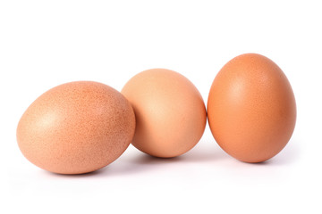 Three brown eggs isolated on white background.Entire image in sharpness.