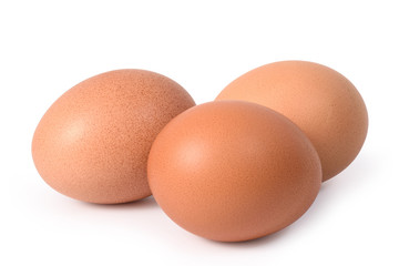 Three brown eggs isolated on white background.Entire image in sharpness.