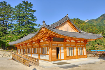 Scenic view of traditional asian or korean style building in Sinheungsa buddhistic monastery in mountains of Dinosaur Ridge in Seoraksan national park near Sokcho in South Korea.