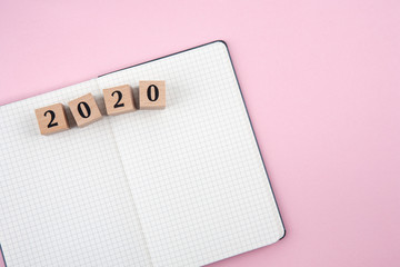 New Year 2020 notebook on pink background