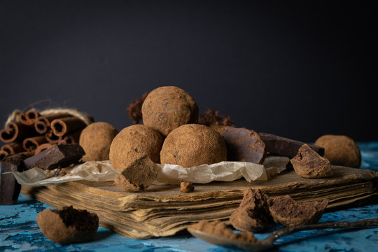 Craft chocolate truffles on turquoise background