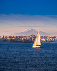 Great view of Syracuse from the other side of the harbour. In background the Etna volcano