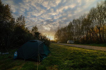 Beautiful golden Sunrise at campsite.