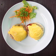 Eggs Benedict- toasted English muffins, poached eggs, and delicious buttery hollandaise sauce