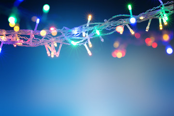 Beautiful background with Christmas light garland with copy space. Holidays concept. 