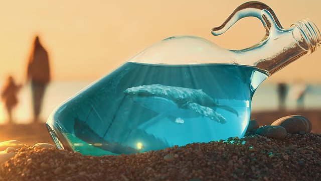 Whale In A Bottle With A Blue Sea And A Sunken Ship At The Bottom. Amazing Find On The Beach. Fantastic Picture Of The Deep Sea. Mother And Baby Are Walking On The Beach At Sunset On the Background
