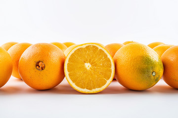 Fresh Nangan Navel Orange and pulp slices on white background