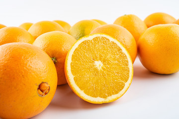 Fresh Nangan Navel Orange and pulp slices on white background