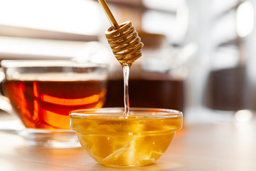 Close up of glass tea cup with honey