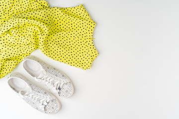 Flat lay of woman summer outfit on white background