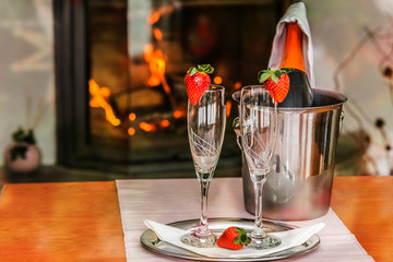 A glass with the champagne, decorated with a strawberry. Romantic composition with champagne and strawberry